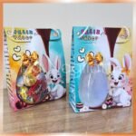 Sacolas de páscoa com visor 3D – 24x 18x 7 cm – coelho menino e menina (Iza)